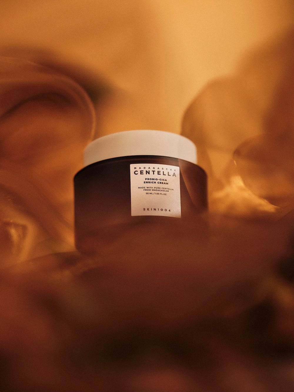 Enrich cream jar standing on shelf