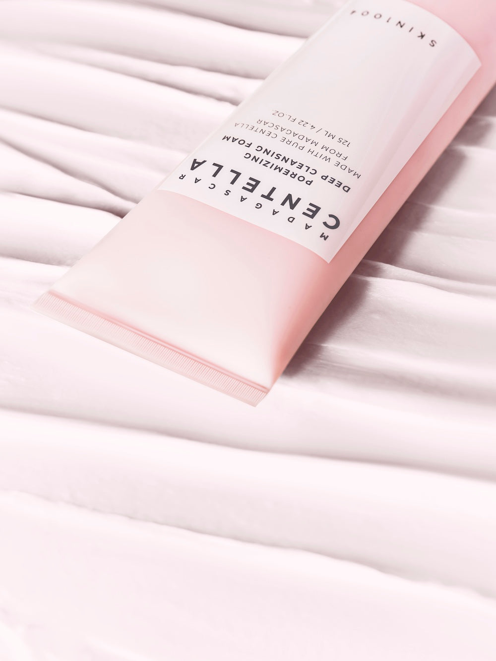 Foam cleanser dispensed into an open palm
