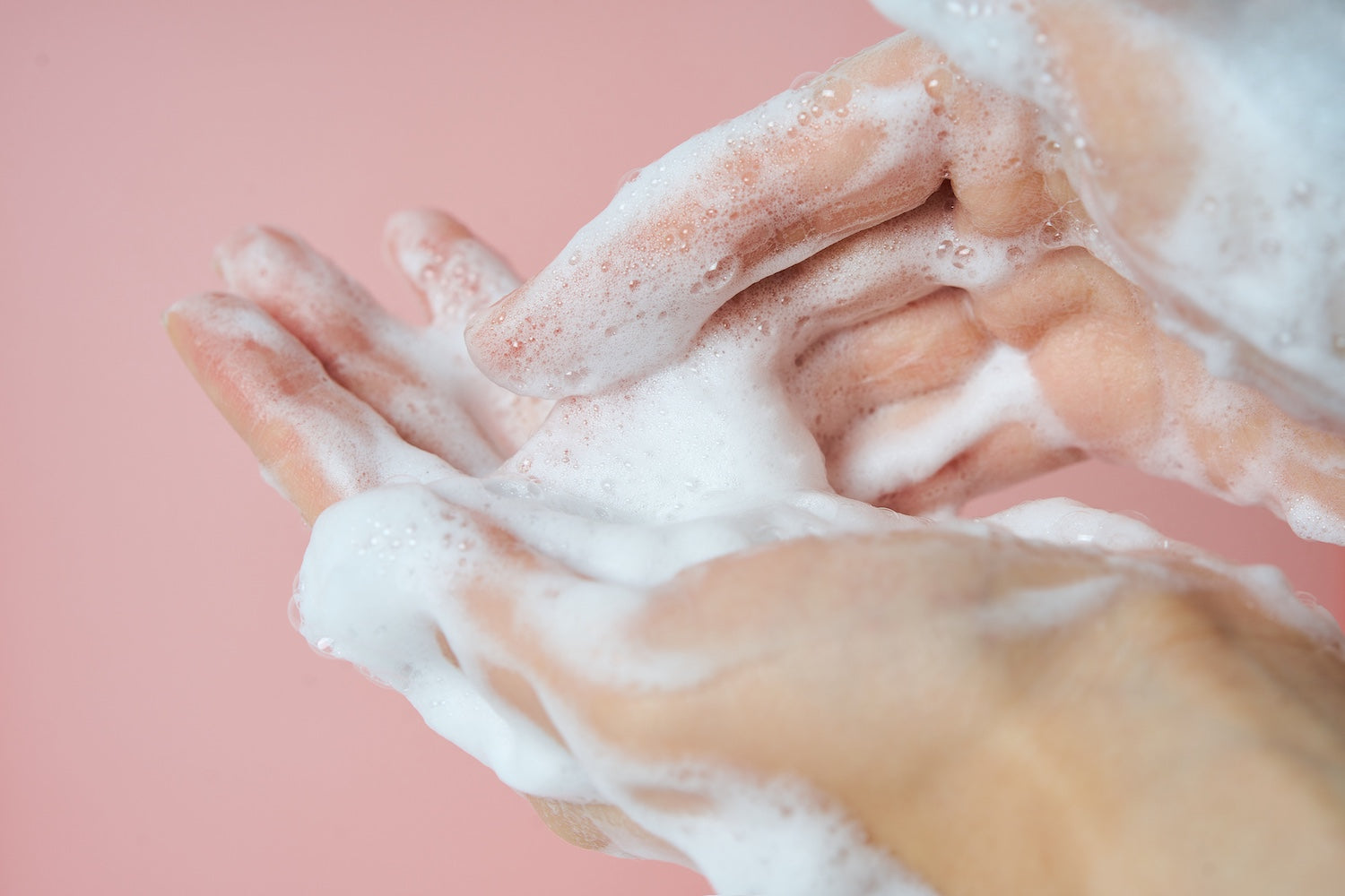 Close-up of foam being massaged across the forehead