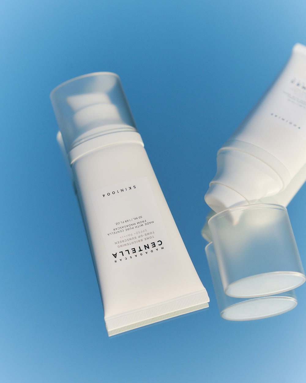 A thin film of sun serum glistening on the back of the hand