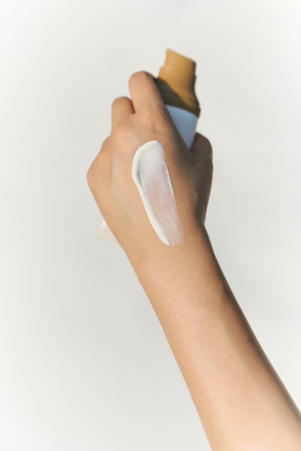 SKIN1004 Air-Fit Suncream Light shown at true size next to a coin for scale