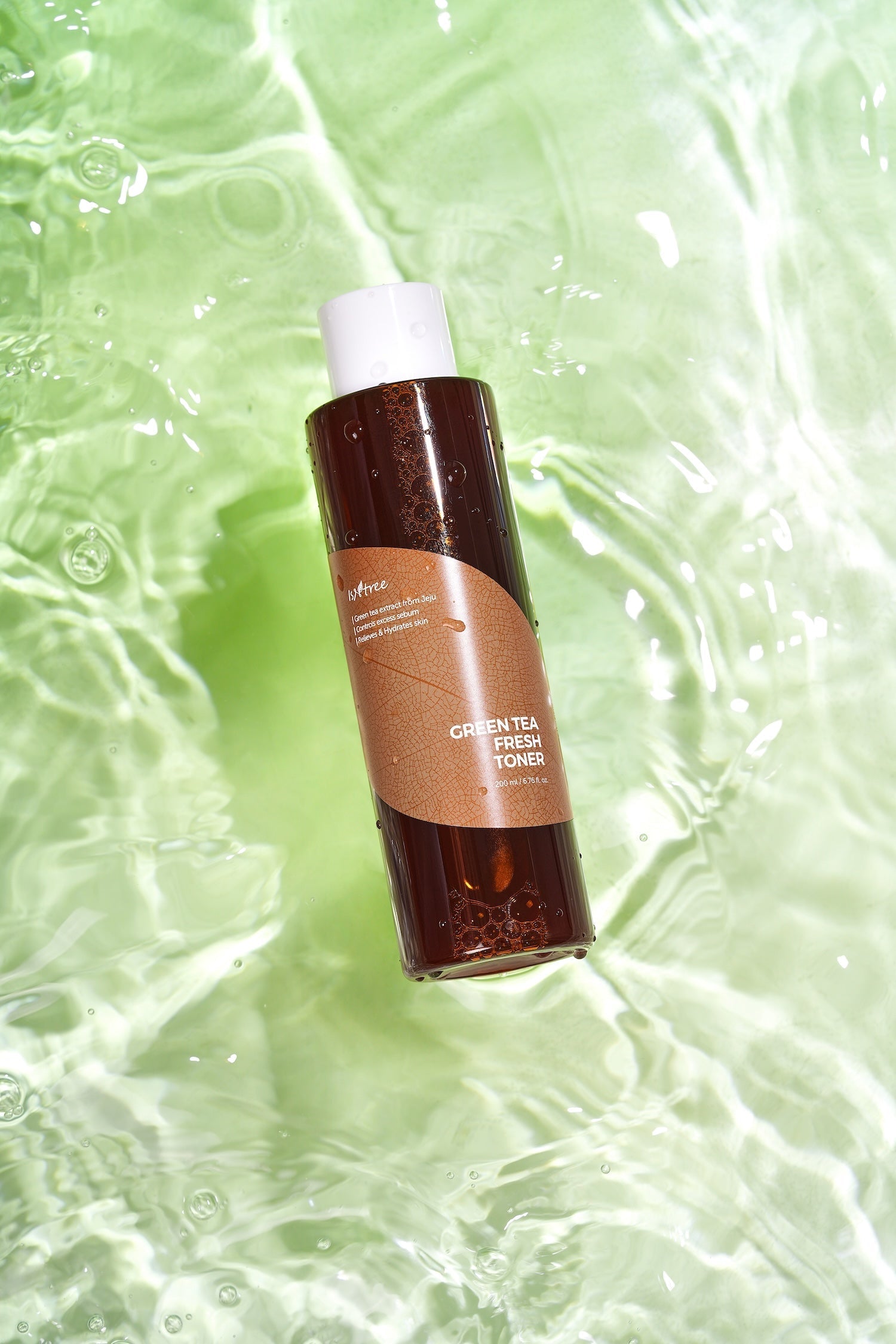 Isntree Green Tea Toner 200ml lifestyle shot on bathroom shelf