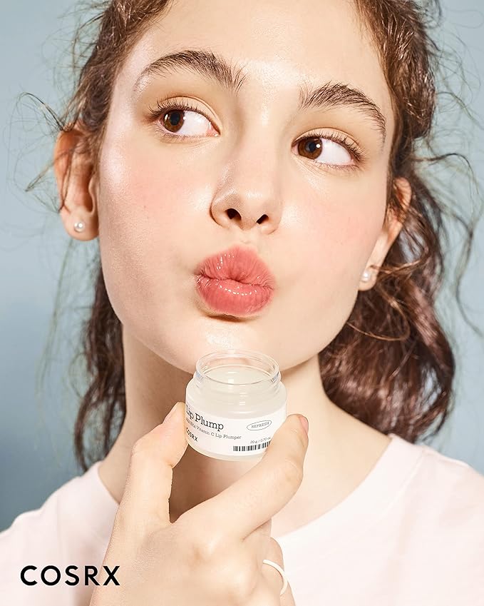 A girl using lip plump