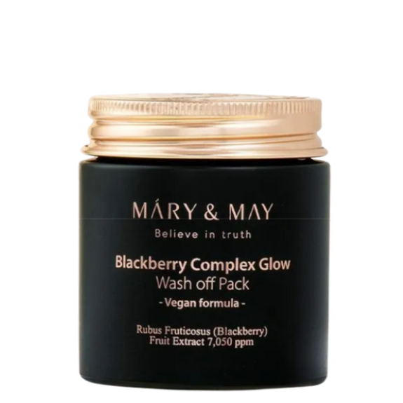 Clay mask being applied thickly to face with brush