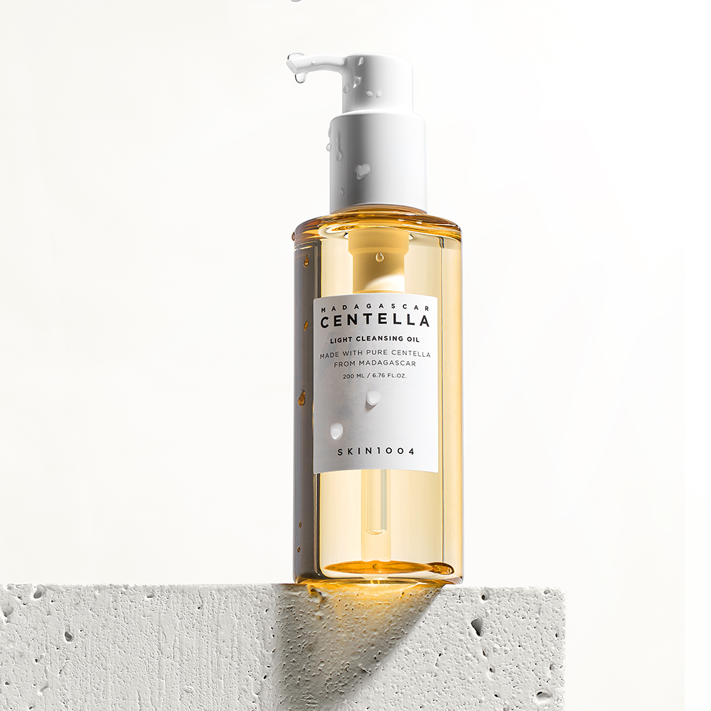 SKIN1004 Light Cleansing Oil bottle held at an angle to show the label