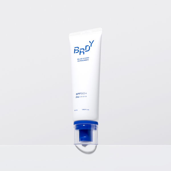 Sunscreen puff applicator close-up showing texture