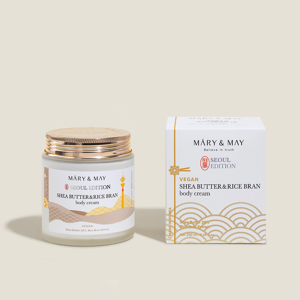Model applying body cream to legs after showering