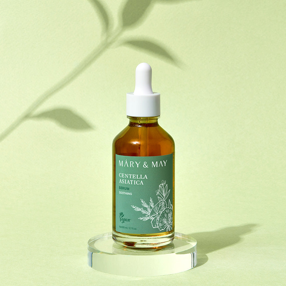 Model applying centella serum during calming skincare routine