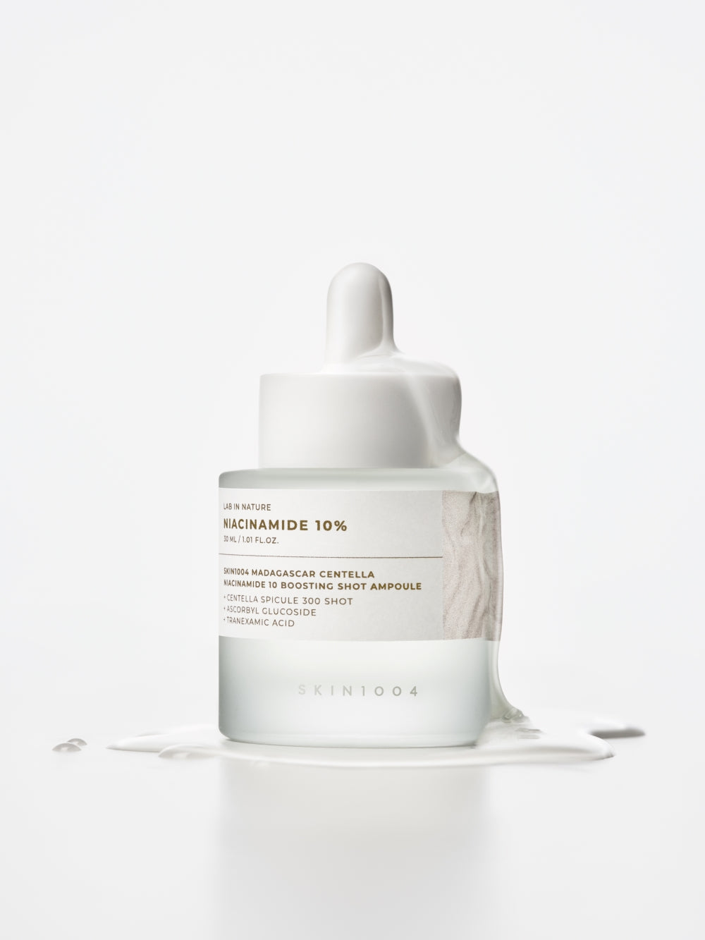 Ampoule bottle held to show 30ml size