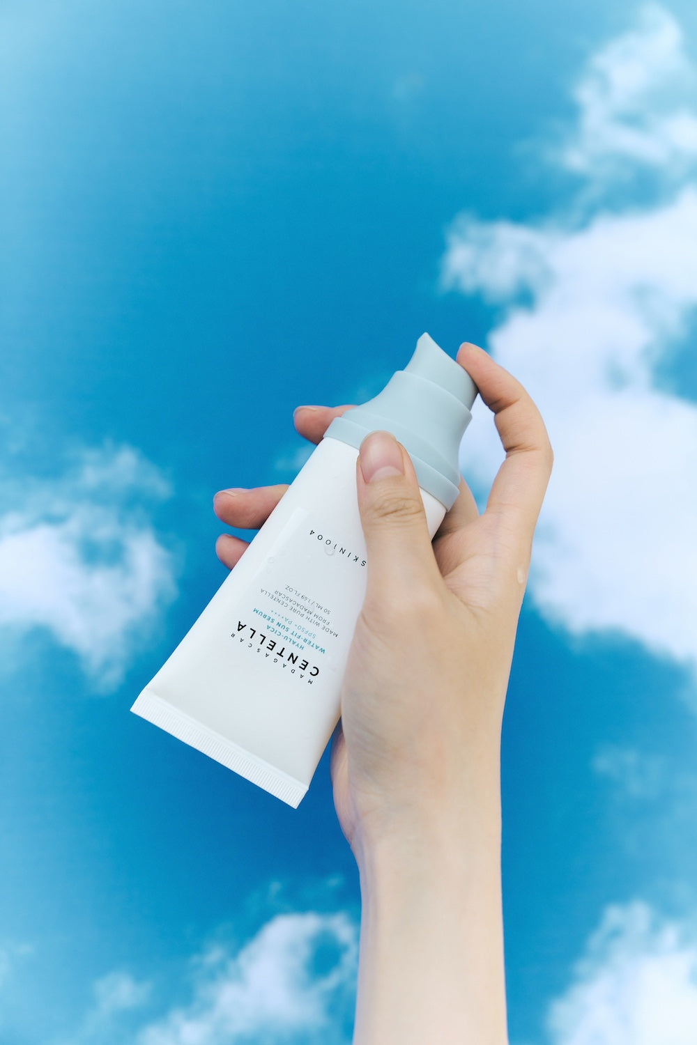 Sun serum bottle standing on bathroom shelf