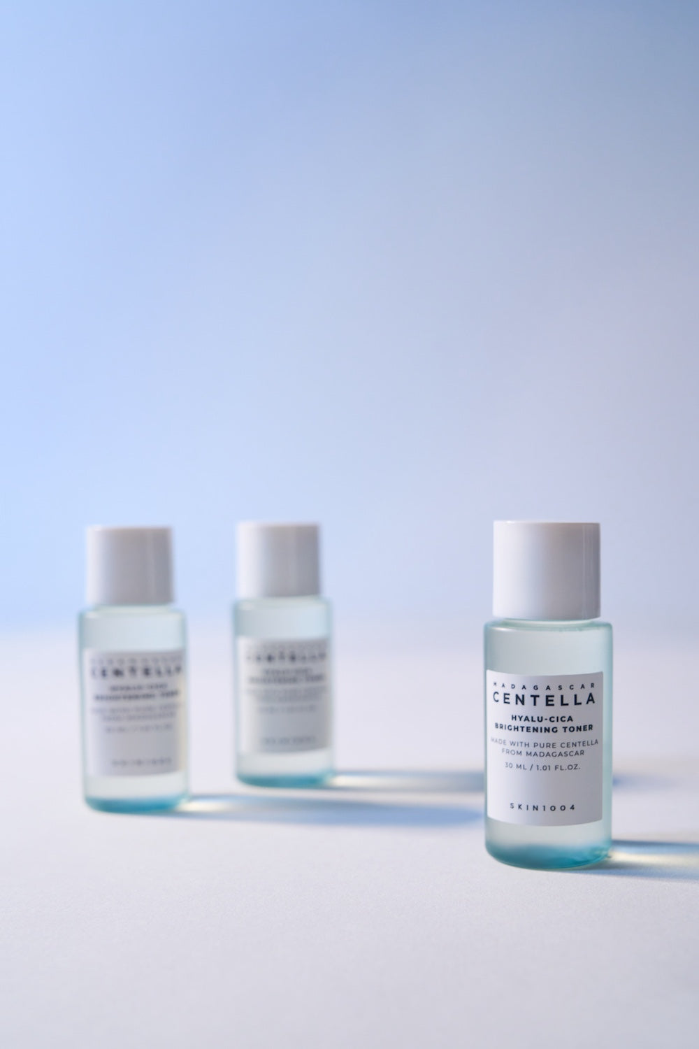 30ml toner bottle held for size reference