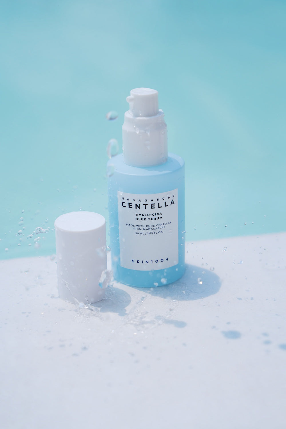 Blue serum bottle next to sleeping pack jar