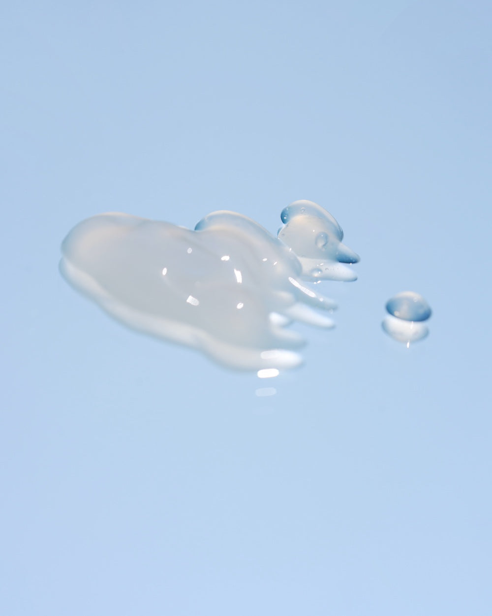 Blue serum bottle and box together on flat lay