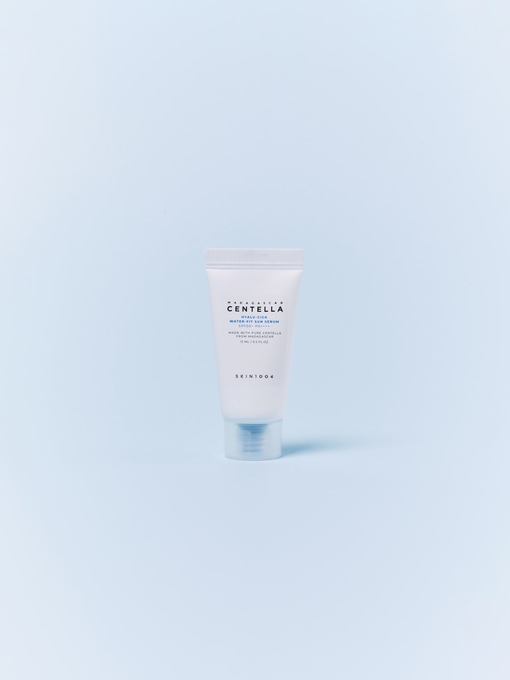 SKIN1004 Hyalu-Cica Water-Fit Sun Serum 15ml bottle held at an angle to show the label