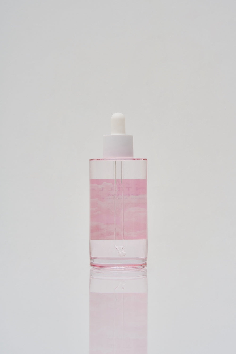Poremizing ampoule bottle photographed on marble