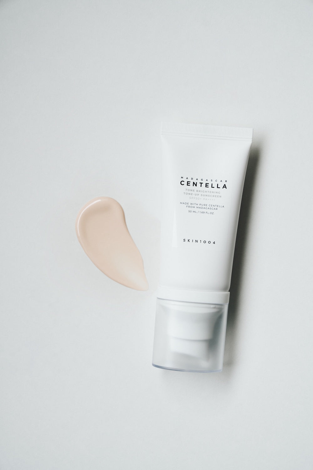 SKIN1004 Tone-Up Sunscreen carried in a small toiletry bag for travel
