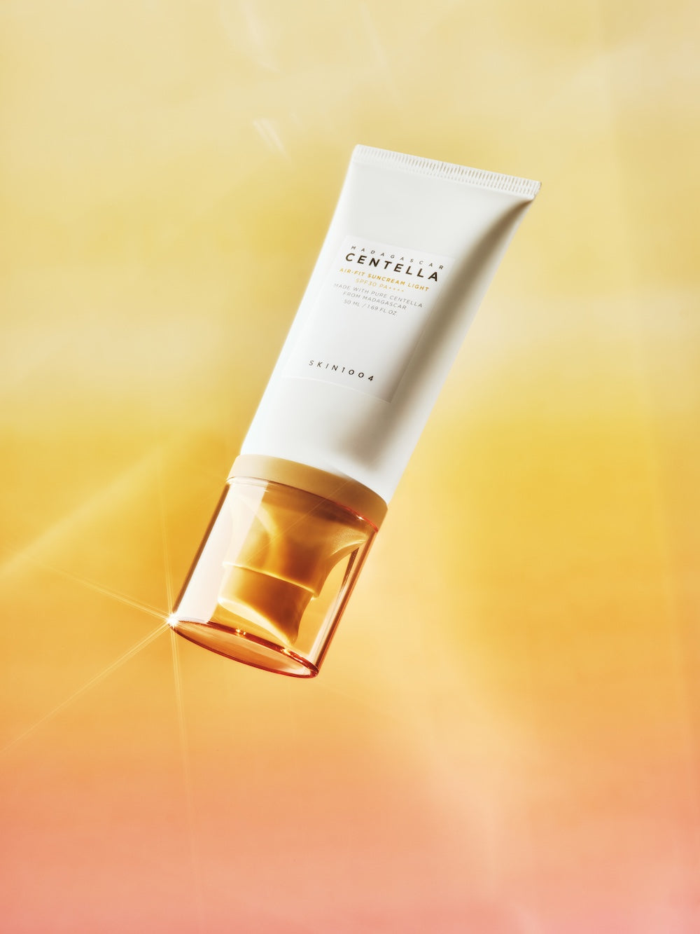 The sun serum being smoothed over the cheek and forehead