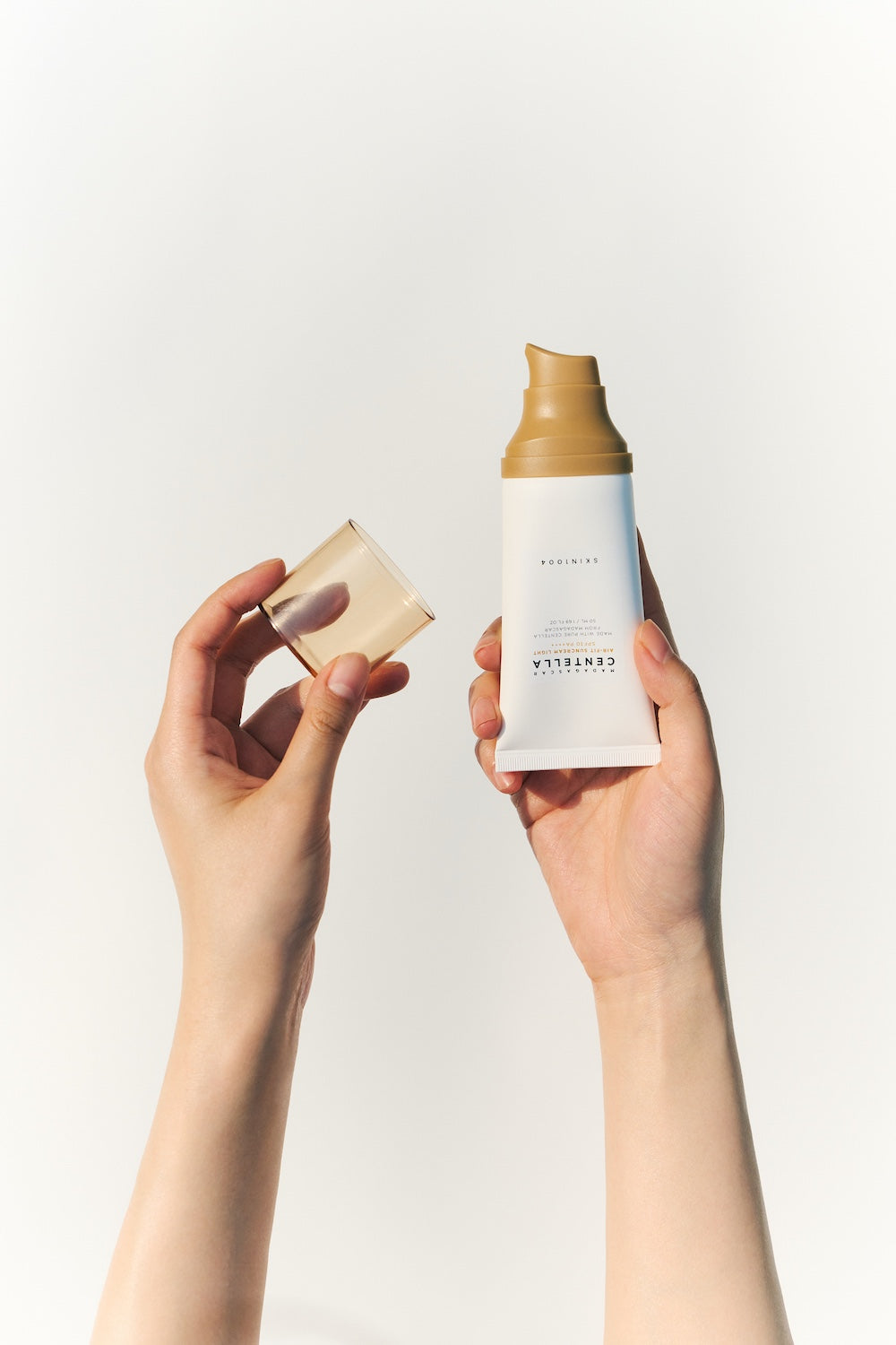 Close-up of the sun serum being patted into the skin