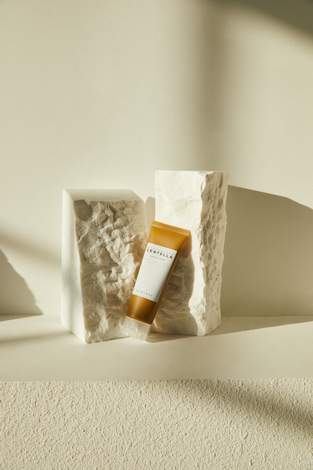 The foam cleanser being massaged onto damp skin