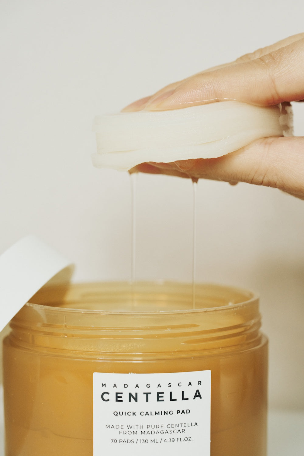 Tub of pads with lid ajar