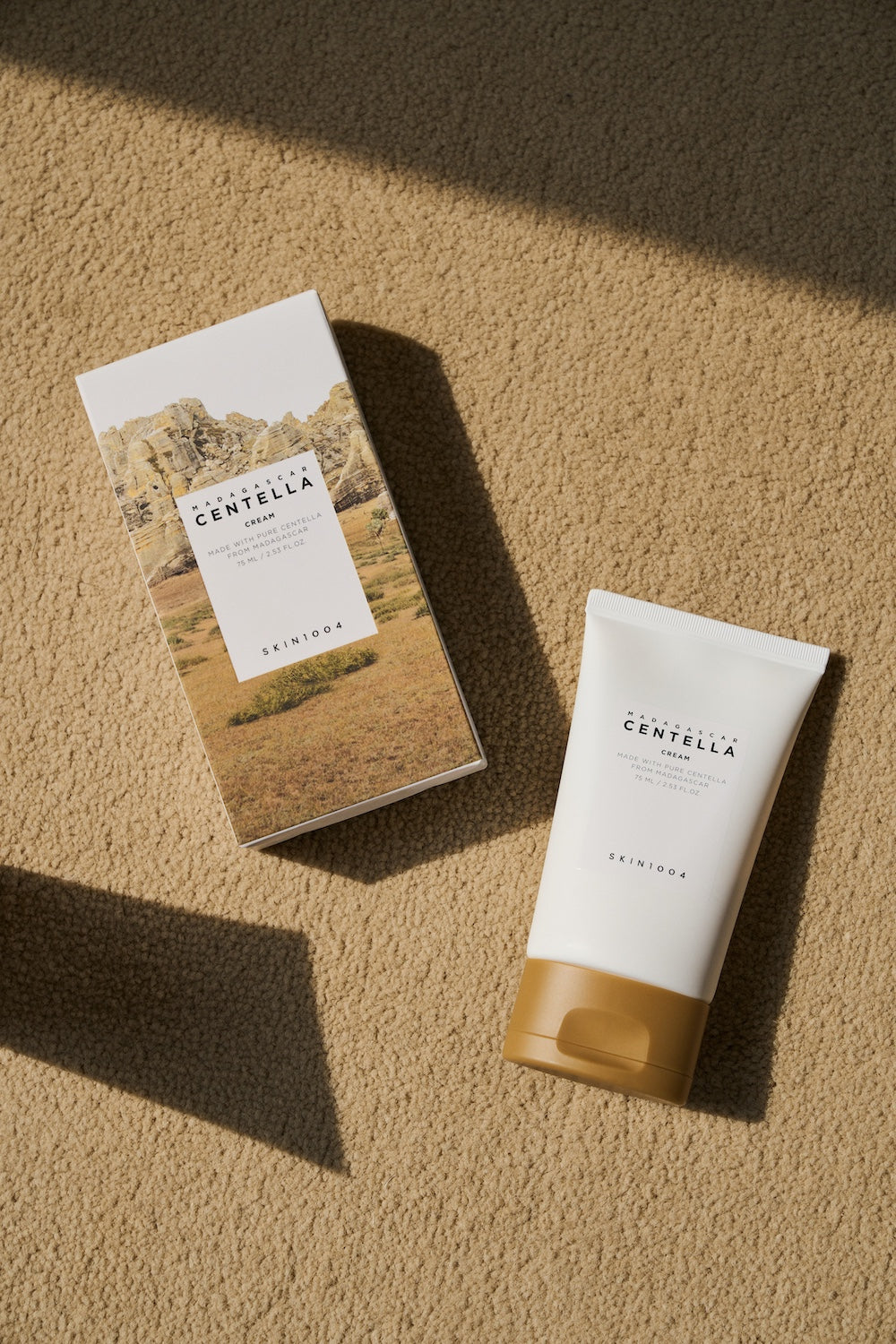 Close-up of SKIN1004 logo on cream jar
