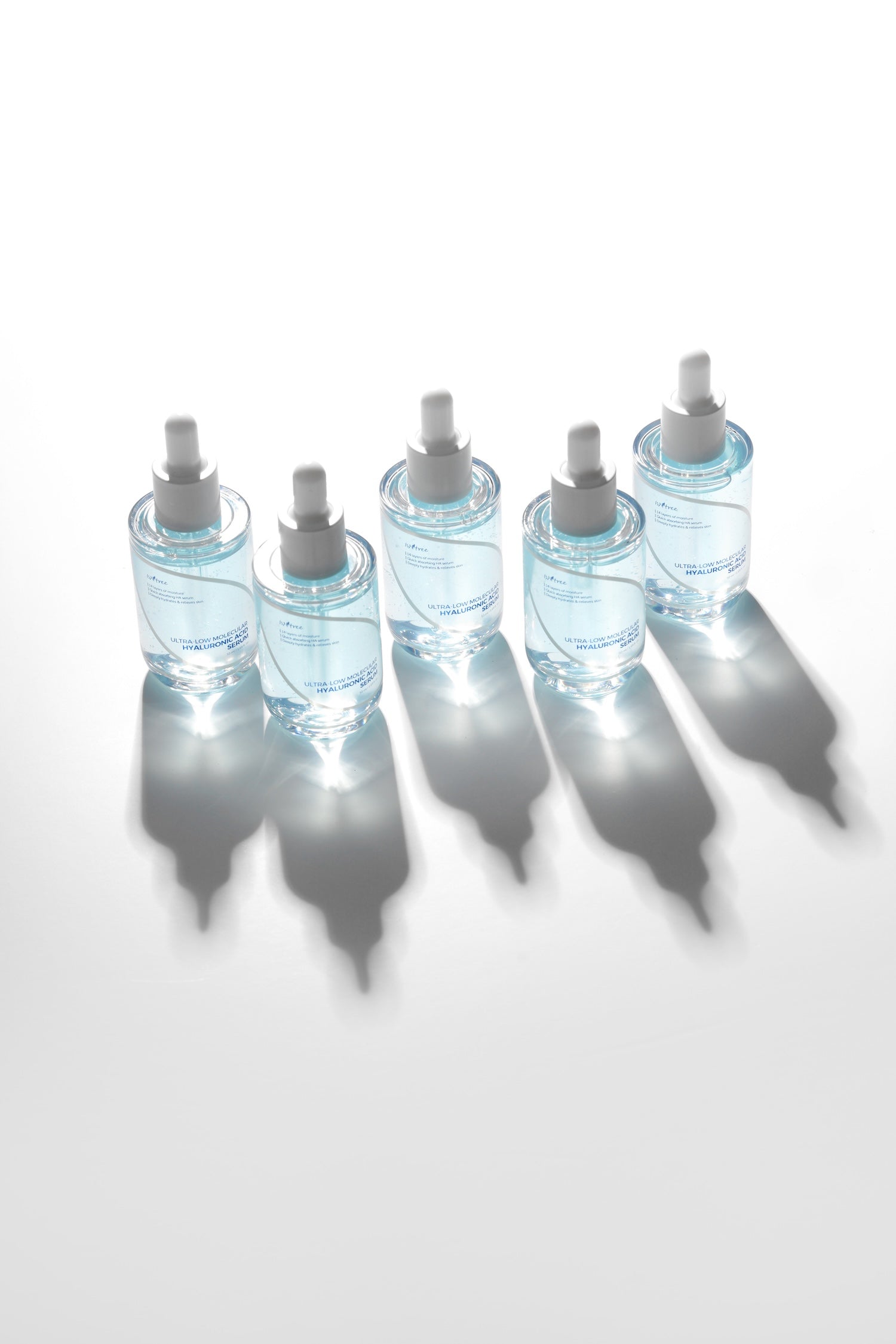 Isntree Ultra Low Molecular HA Serum bottle held up to natural light