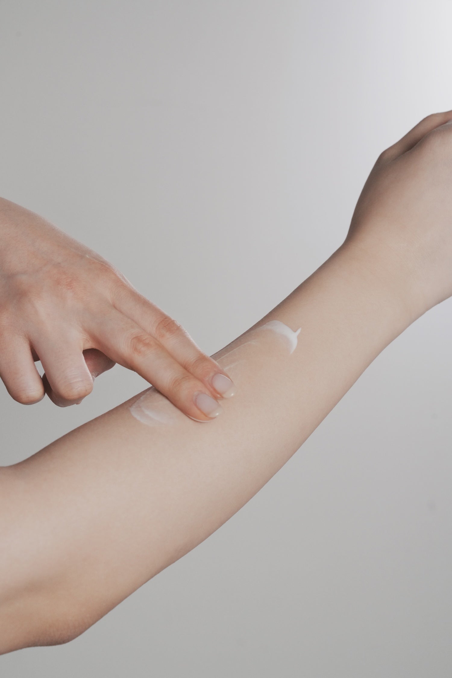 Sun cream absorbed into skin showing non greasy dry down finish