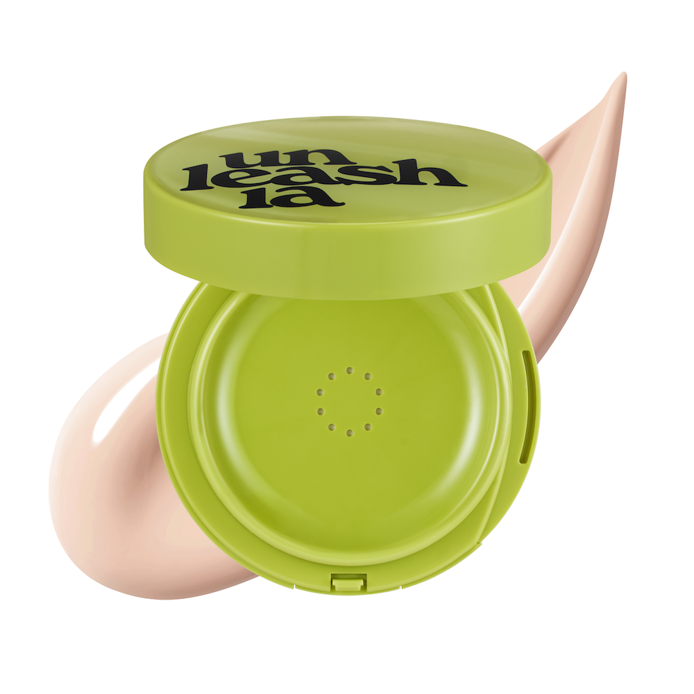 Cushion compact opened showing puff applicator