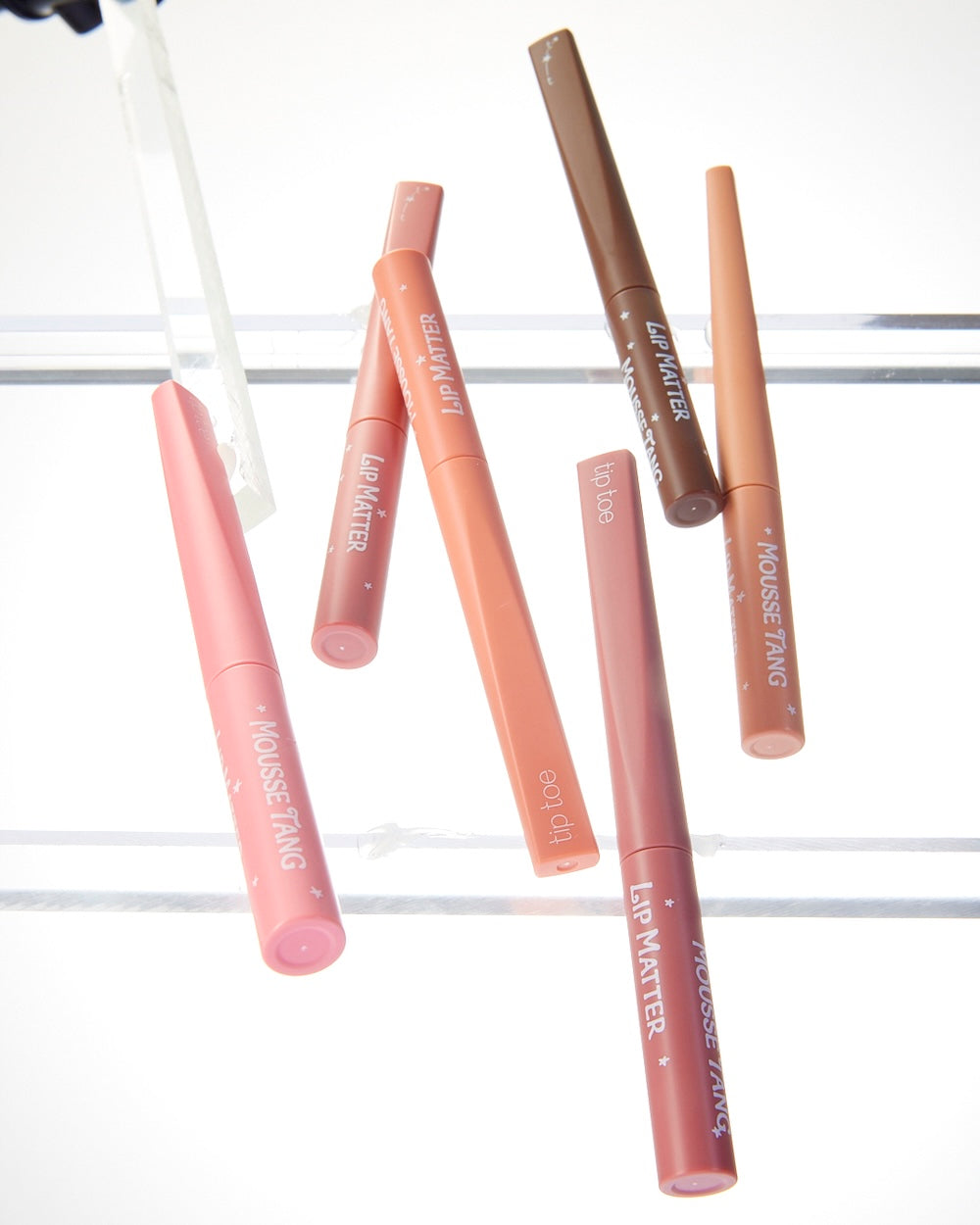 Tiptoe Mousse Tang Lip Matter 001 Amelie shown next to its outer packaging box