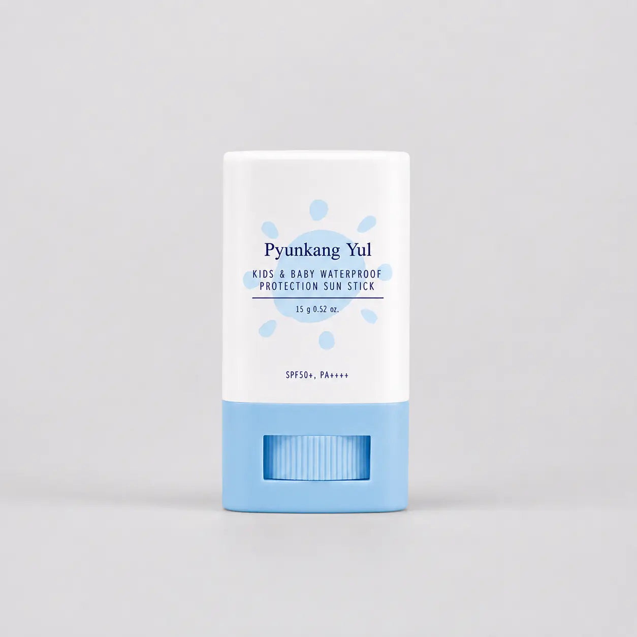 Pyunkang Yul waterproof sun stick, cap on, standing upright